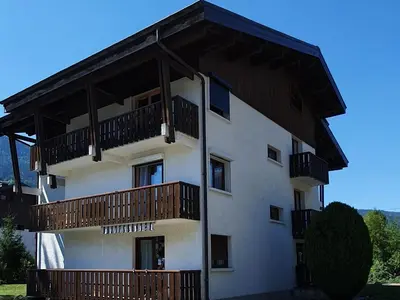 a building with balconies on the side of it at Appartement 4 pers. 1 ch. avec lave-linge à Samoëns - FR-1-846-37 in Samoëns