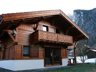 a log cabin with a balcony on top of it at Chalet pour 8 avec Wifi à Samoëns - FR-1-846-36 in Samoëns
