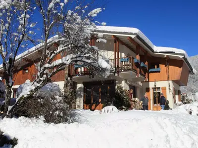a building with snow on the ground in front of it at Charmante Villa à Samoëns avec Wifi et 2 Chambres - FR-1-846-34 in Samoëns