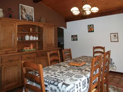 a dining room with a table and some chairs at Charmante Villa à Samoëns avec Wifi et 2 Chambres - FR-1-846-34 in Samoëns