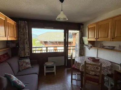 a living room with a couch and a table at Studio Samoëns - 4 pers, cosy & pratique - FR-1-846-33 in Samoëns
