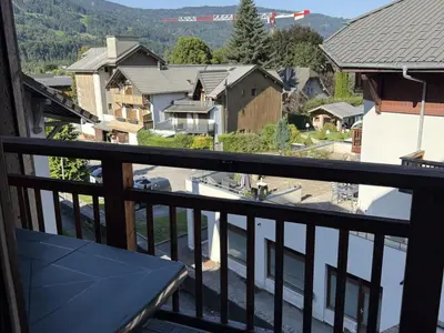 a balcony with a view of a town at Studio Samoëns - 4 pers, cosy & pratique - FR-1-846-33 in Samoëns