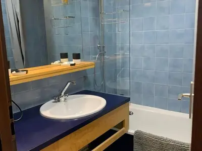 a bathroom with a sink and a shower at Charmant appartement avec Wifi à Samoëns - FR-1-846-35 in Samoëns