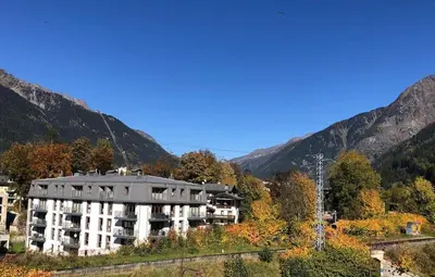 a large building in the middle of a mountain at Appartement Phoebe, Chamonix Centre in Chamonix-Mont-Blanc