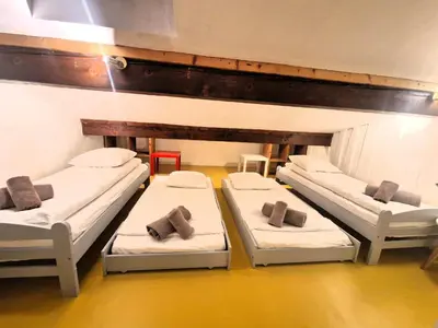 a room with four beds in a room at Appartement Phoebe, Chamonix Centre in Chamonix-Mont-Blanc