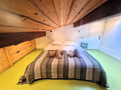 a bedroom with a bed with two stuffed animals on it at Appartement Phoebe, Chamonix Centre in Chamonix-Mont-Blanc