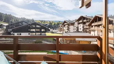 a balcony with a view of a resort at Les Eterlous N24 2P6 in Morillon