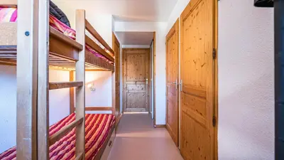 a corridor of a room with bunk beds at Les Eterlous N24 2P6 in Morillon