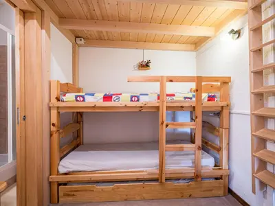 a bunk bed in a tiny house at Grand Horizon 1 N403 2P8 in Morillon