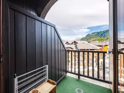 a balcony with a view of a city at Grand Horizon 1 N403 2P8 in Morillon