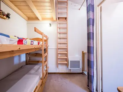 a small room with bunk beds and a window at Grand Horizon 1 N403 2P8 in Morillon