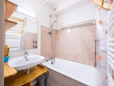a bathroom with a sink and a bath tub at Grand Horizon 1 N403 2P8 in Morillon