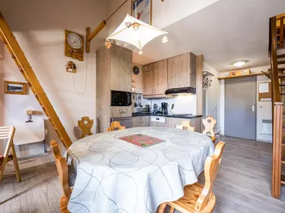 a kitchen and dining room with a table and chairs at Grand Horizon 1 N403 2P8 in Morillon