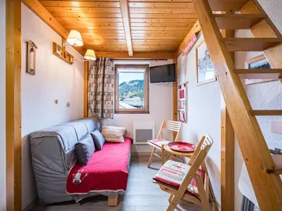 a small living room with a couch and a table at Grand Horizon 1 N403 2P8 in Morillon