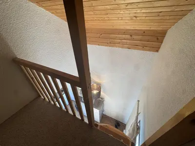 an overhead view of a staircase with a wooden ceiling at Studio avec mezzanine, balcon et parking privé - Animaux acceptés - FR-1-836-9 in Arâches-la-Frasse