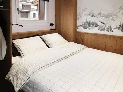 a bedroom with two white beds and a window at Appartement central 1 chambre, 4 pers, WIFI, garage - FR-1-836-12 in Arâches-la-Frasse