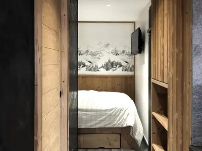 a bedroom with a bed and a painting on the wall at Appartement central 1 chambre, 4 pers, WIFI, garage - FR-1-836-12 in Arâches-la-Frasse