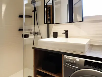 a bathroom with a white sink and a shower at Appartement central 1 chambre, 4 pers, WIFI, garage - FR-1-836-12 in Arâches-la-Frasse