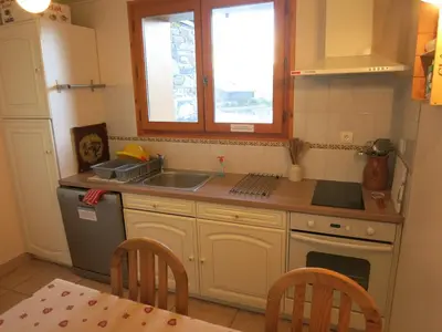 a kitchen with a sink and a counter top at Appartement 2 chambres pour 5 pers avec billard et parking - FR-1-836-11 in Arâches-la-Frasse