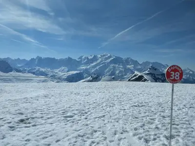 a stop sign in the snow with mountains in the background at Studio 26 m² - 4 pers - Les Carroz d'Arâches - FR-1-836-10 in Arâches-la-Frasse