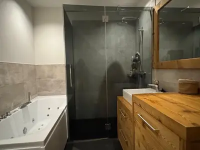 a bathroom with a shower and a tub and a sink at Comfortable house - 4 people - quiet in Chamonix-Mont-Blanc