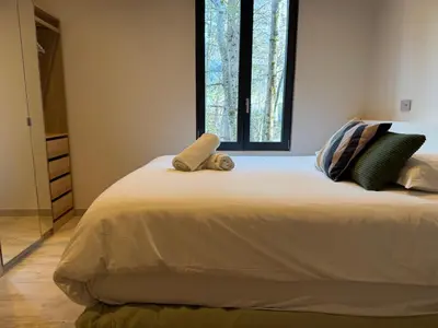 a bedroom with a bed with two stuffed animals on it at Comfortable house - 4 people - quiet in Chamonix-Mont-Blanc