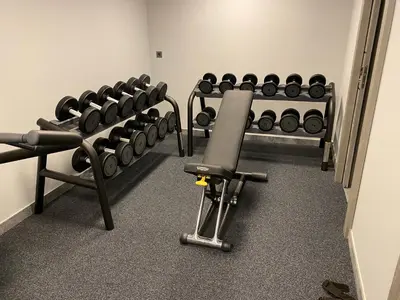 a room with a bunch of exercise equipment in it at Chalet Crystal in Megève