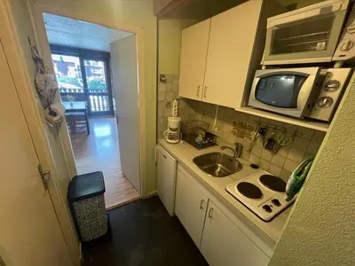 a small kitchen with a sink and a microwave at Appartement à Arâches-la-Frasse pour 4 personnes - FR-1-572-334 in Arâches-la-Frasse