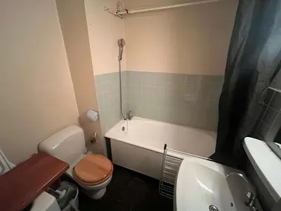 a bathroom with a toilet and a tub and a sink at Appartement à Arâches-la-Frasse pour 4 personnes - FR-1-572-334 in Arâches-la-Frasse