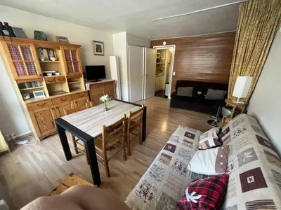 a living room with a table and a couch at Appartement à Arâches-la-Frasse pour 4 personnes - FR-1-572-334 in Arâches-la-Frasse