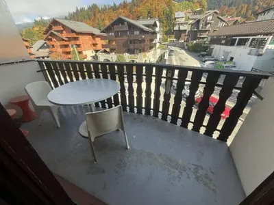 a white table and chairs on a balcony at Appartement à Arâches-la-Frasse pour 4 personnes - FR-1-572-334 in Arâches-la-Frasse