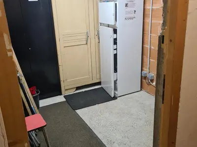 a hallway with a refrigerator in a room at Studio rénové pour 4 au pied de la piste de luge - FR-1-836-13 in Arâches-la-Frasse