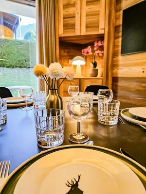 a table with a plate with a spider on it at Le Majestic - Proche pistes et centre ville in Megève