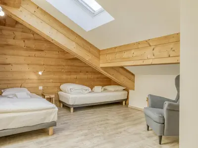 a living room with a couch and a table at Duplex 4 pièces, 3 chambres, 6 personnes, proche centre, parking, wifi - FR-1-663-52 in Saint-Gervais-les-Bains