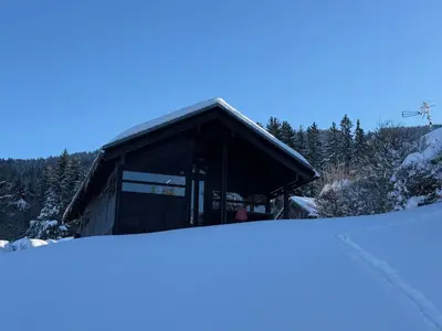 a small building in the snow with a pile of snow at Chalet refait à neuf avec parking privé - 4 pers. - FR-1-836-38 in Arâches-la-Frasse