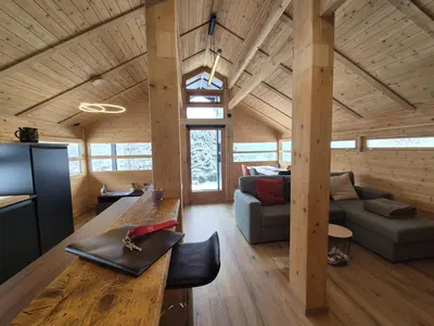 a bedroom with a bed and a lamp in a room at Chalet refait à neuf avec parking privé - 4 pers. - FR-1-836-38 in Arâches-la-Frasse