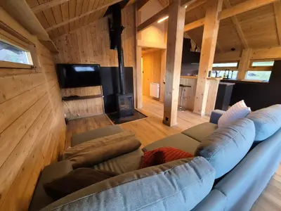 a small bedroom with a bed in a wooden room at Chalet refait à neuf avec parking privé - 4 pers. - FR-1-836-38 in Arâches-la-Frasse