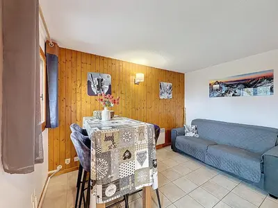 a living room with a couch and a table at Charmant 2 Pièces proche piste à Combloux - FR-1-560-169 in Combloux