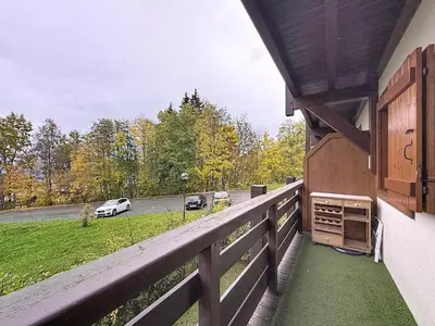 a balcony of a house with a view of a parking lot at Charmant 2 Pièces proche piste à Combloux - FR-1-560-169 in Combloux