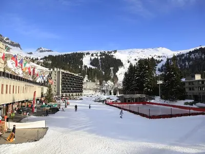 a group of people skiing down a snow covered slope at Studio cosy 4 pers, 300m des pistes, Flaine - FR-1-687-97 in Arâches-la-Frasse