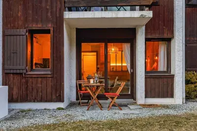 a table and chairs in front of a house at Argy - Apart Moderne - Vue MtBlanc - 5mn Pistes - Parking in Chamonix-Mont-Blanc
