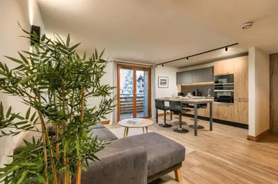 a living room with a couch and a table at Wim in Les Houches