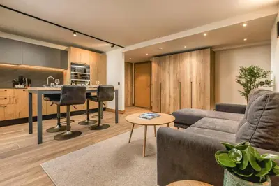 a living room with a couch and a table at Wim in Les Houches