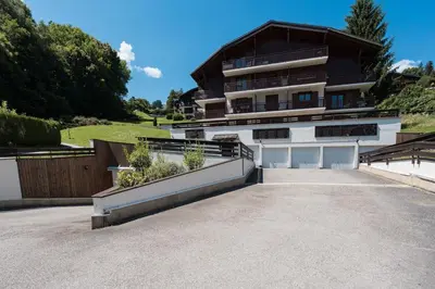a large house with a driveway in front of it at 2 bedroom apartment, in Saint-Gervais-les-Bains