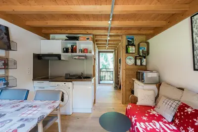 a small living room with a couch and a table at 2 bedroom apartment, in Saint-Gervais-les-Bains