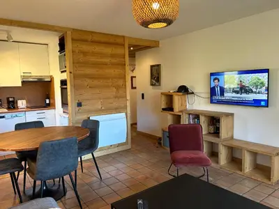 a kitchen and dining room with a table and chairs at Sunny 2 Bedrooms Apartment for 4 in Megève Jaillet, right on the Ski Slopes in Megève