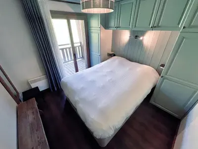 a small bedroom with a white bed and a window at Sunny 2 Bedrooms Apartment for 4 in Megève Jaillet, right on the Ski Slopes in Megève