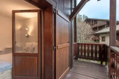 a balcony with a door leading to a bedroom at Grand Balcon 7 in Les Houches