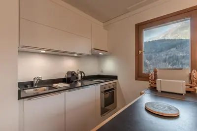 a kitchen with a view of a mountain at Grand Balcon 7 in Les Houches