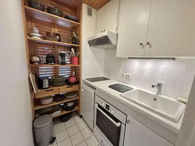 a small kitchen with a sink and a counter at Appartement Megève 3 pièces, 4-6 personnes, parking - FR-1-597-195 in Megève